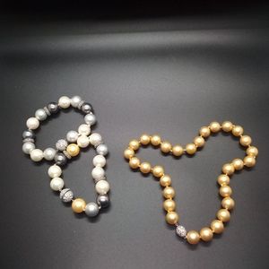 2/$10 Fashion jewelry gold pearl necklace and 2 gray and silver pearl bracelets.